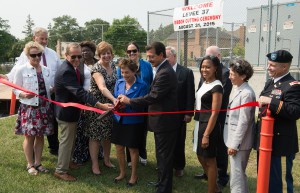 Public officials from state and local government as well as representatives of the Metropolitan Water Reclamation District of Greater Chicago and U.S. Army Corps of Engineers cut the ribbon on the new Levee 37 project. Image provided by MWRD