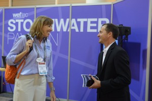 Theresa Connor of the Water Environment Research Foundation talks to an attendee after her presentation in the Stormwater Pavilion Theater. Image credit: Oscar & Associates