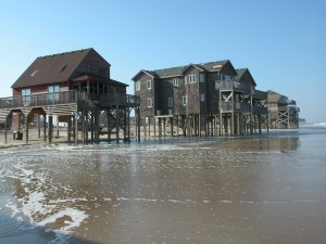 Houses in Rodanthe, NC, are left in the waves at the ocean's edge following the passage of Hurricane Isabel, which made landfall as a category 2 storm in the Outer Banks on September 18, 2003. U.S. Geological Survey/photo by Hilary Stockdon
