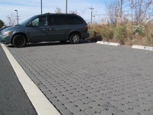 WSSI's concrete pavers reduce impervious area by 511 sq m (5,502 sf), and drain to an existing vegetated floodplain. They cost $76/sq m ($7.10/sf) to install. Image credit: WSSI